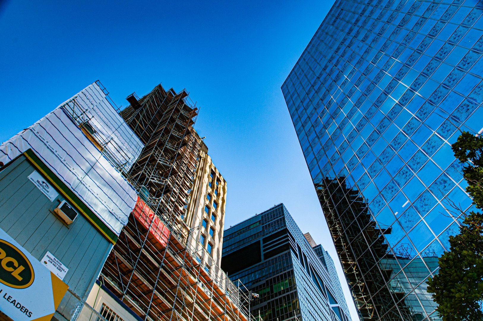 a group of tall buildings next to each other